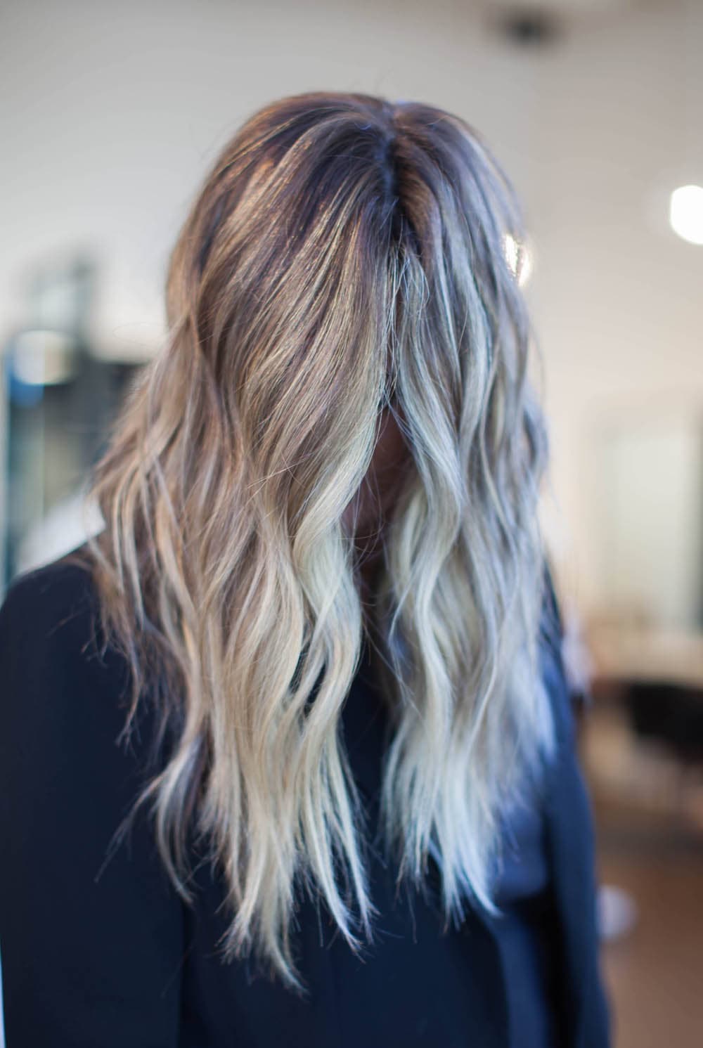 Long full blonde hair with added length and volume at Pursuit Salon in Los Altos