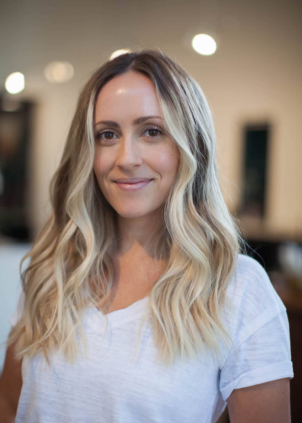 Warm golden blonde balayage waves at Pursuit Salon in Los Altos